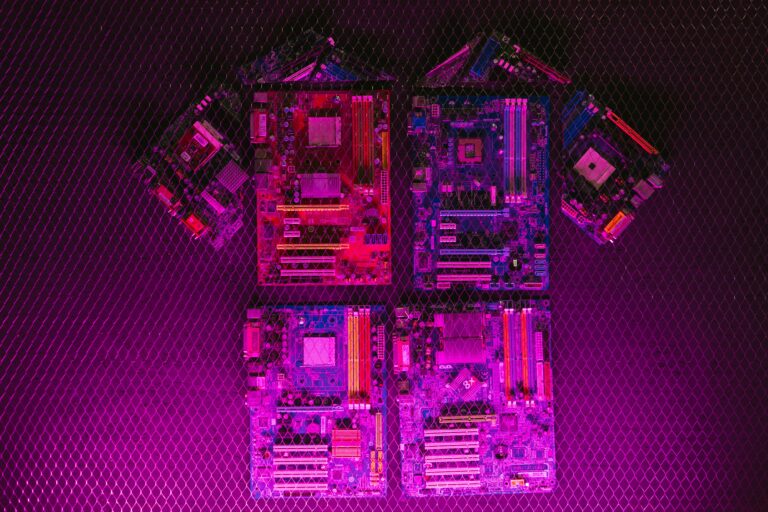 Creative arrangement of circuit boards with neon lighting, highlighting modern technology aesthetics.